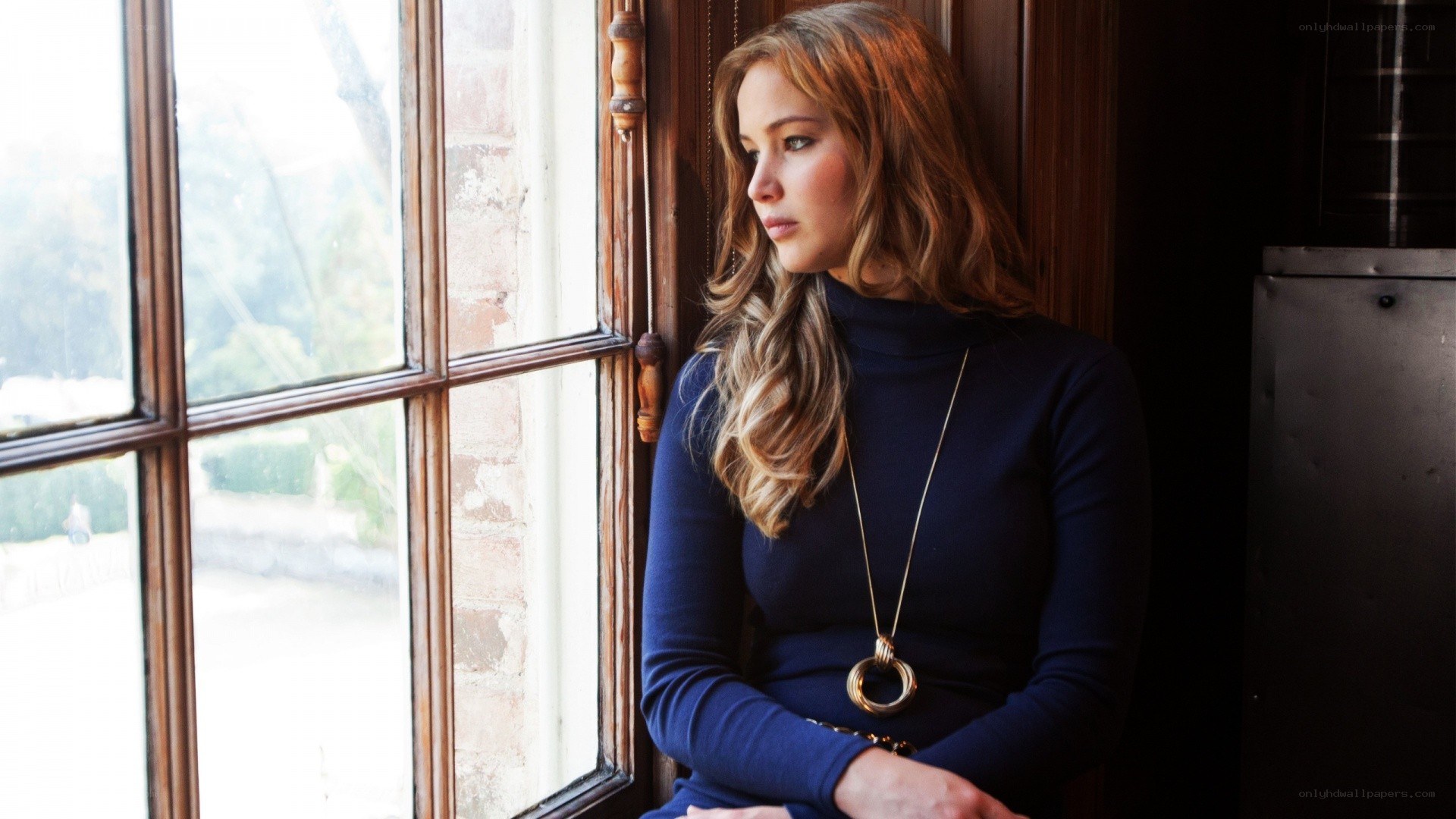 woman looking out window