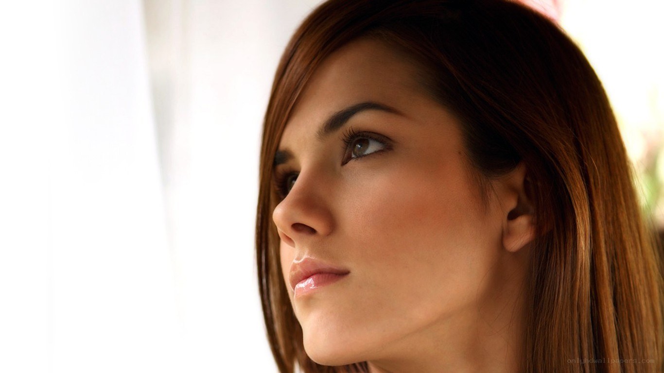 woman looking out window