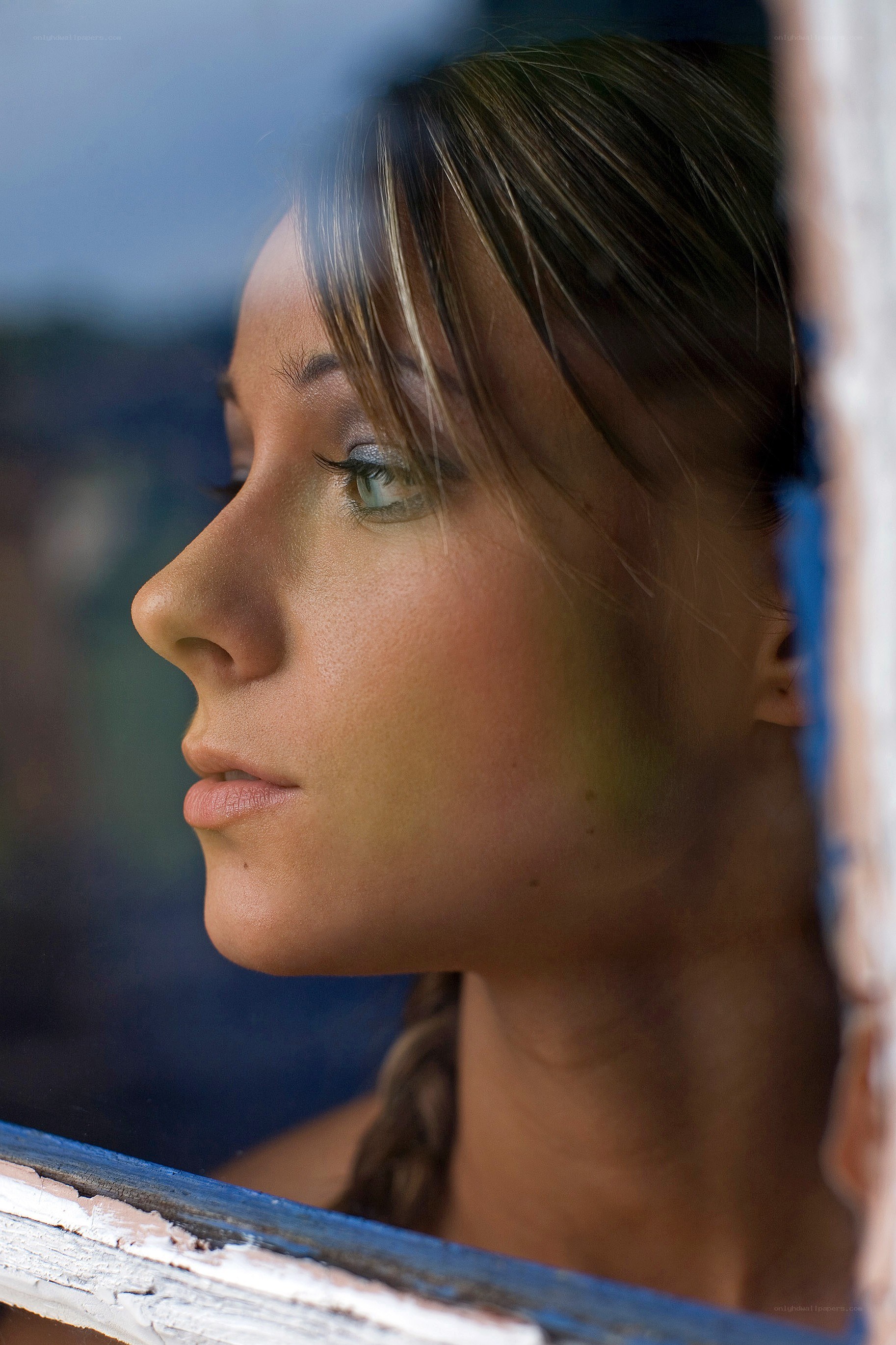 woman looking out window