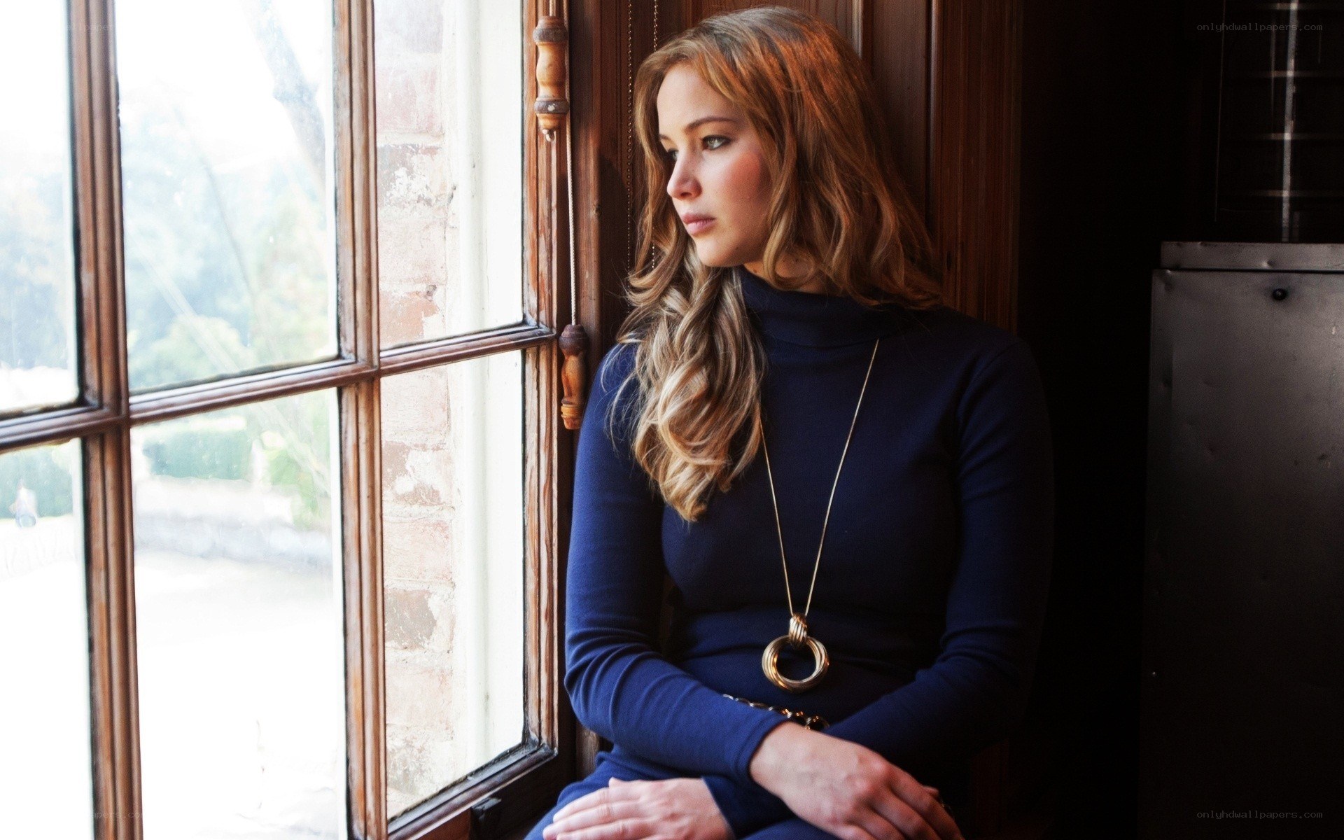 woman looking out window