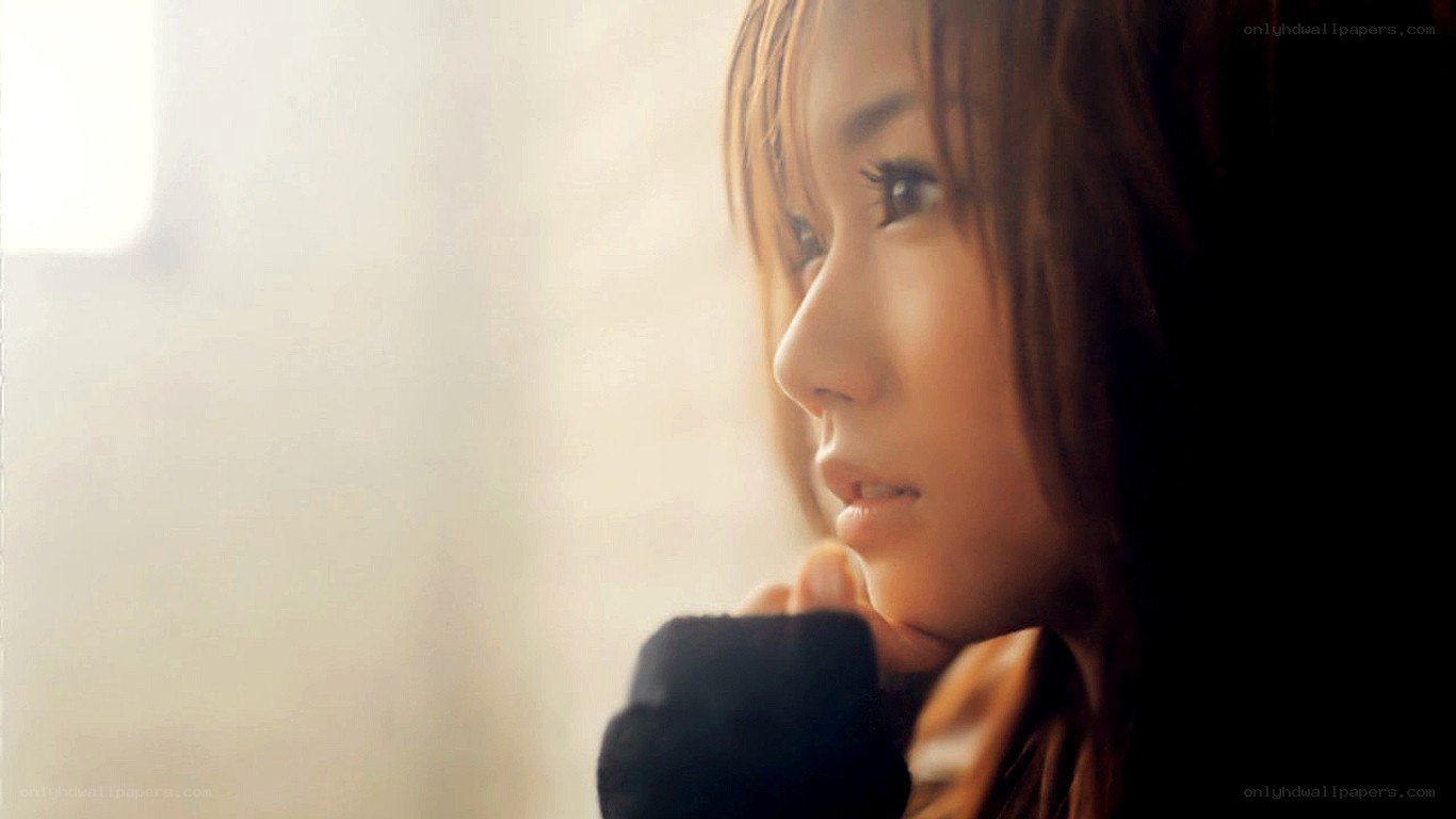 woman looking out window
