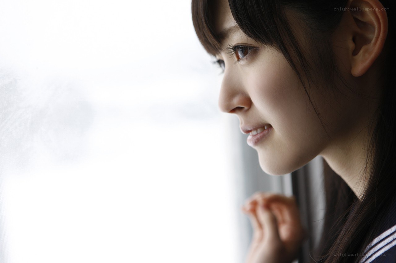 woman looking out window