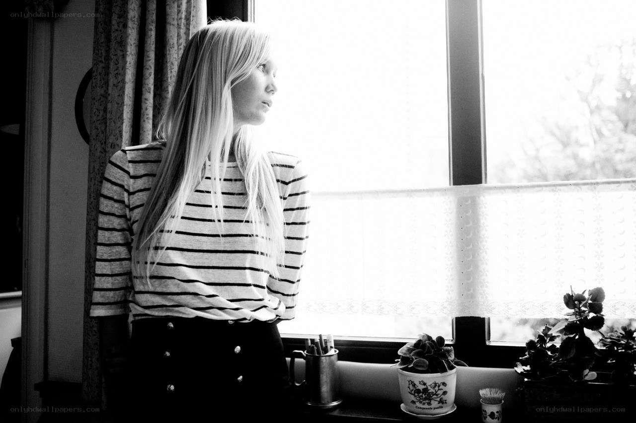 woman looking out window