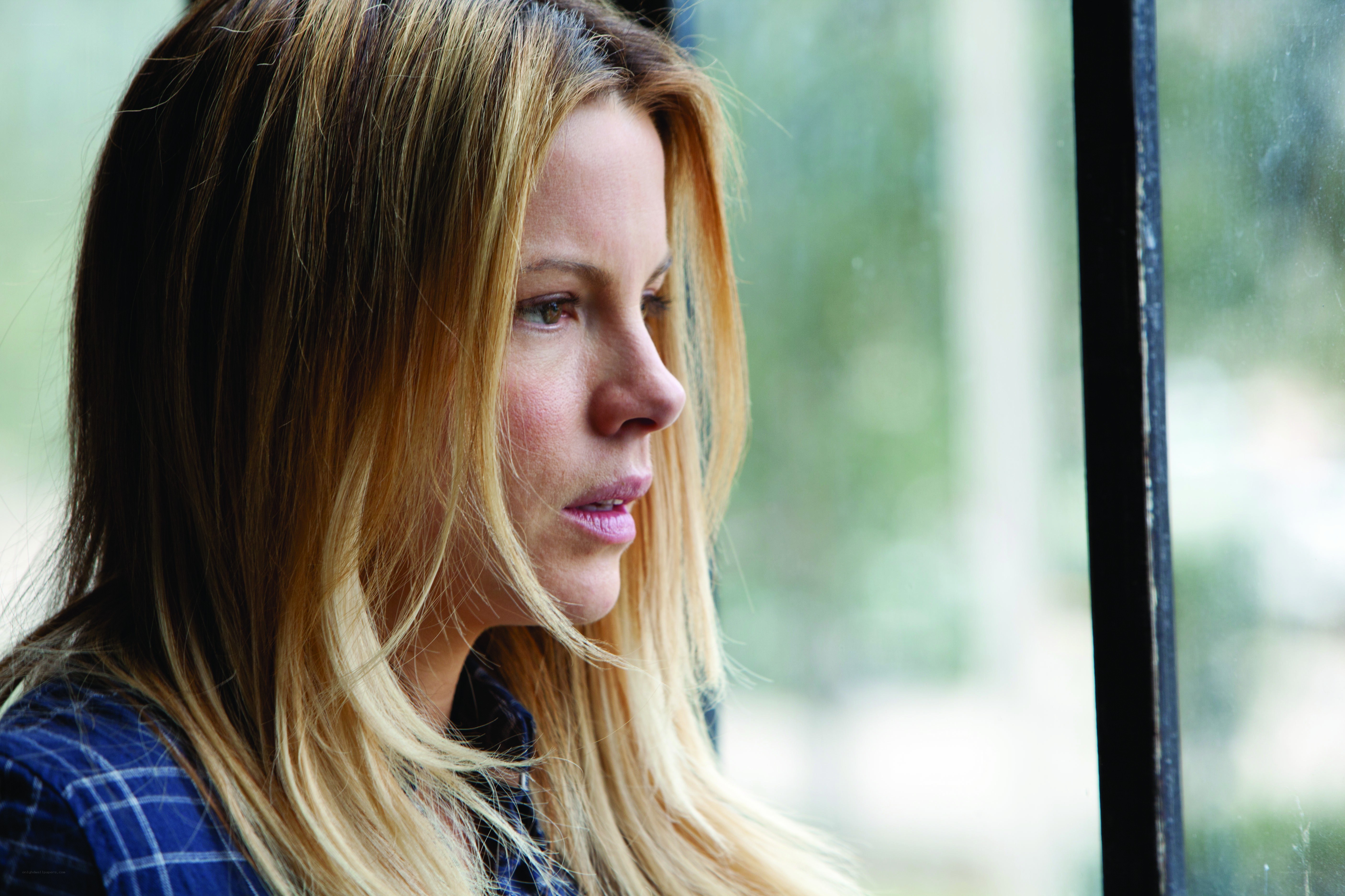woman looking out window