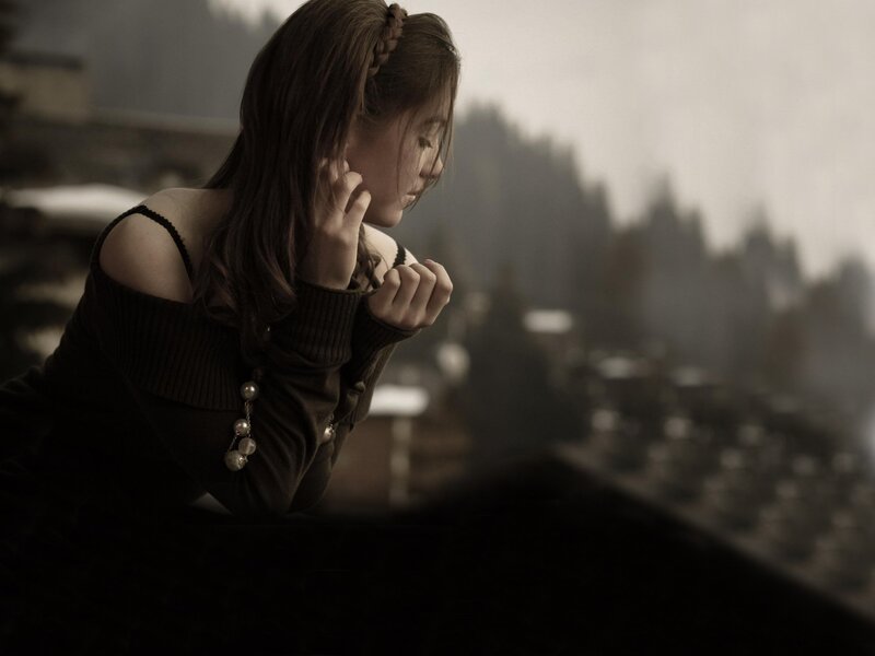 woman looking out window
