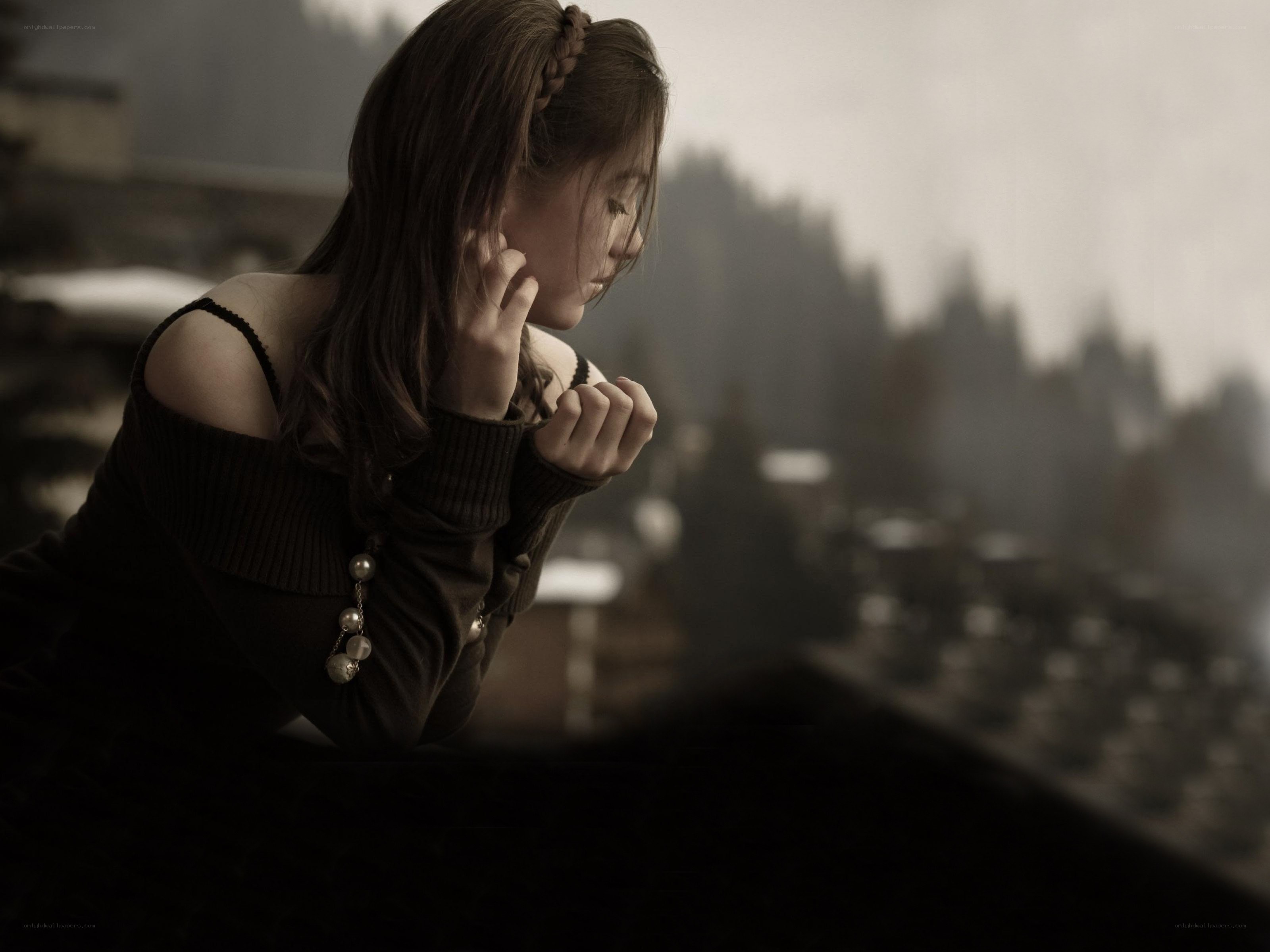 woman looking out window