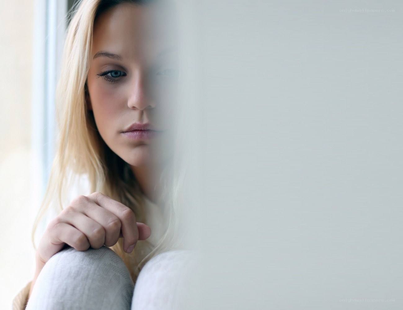 woman looking out window