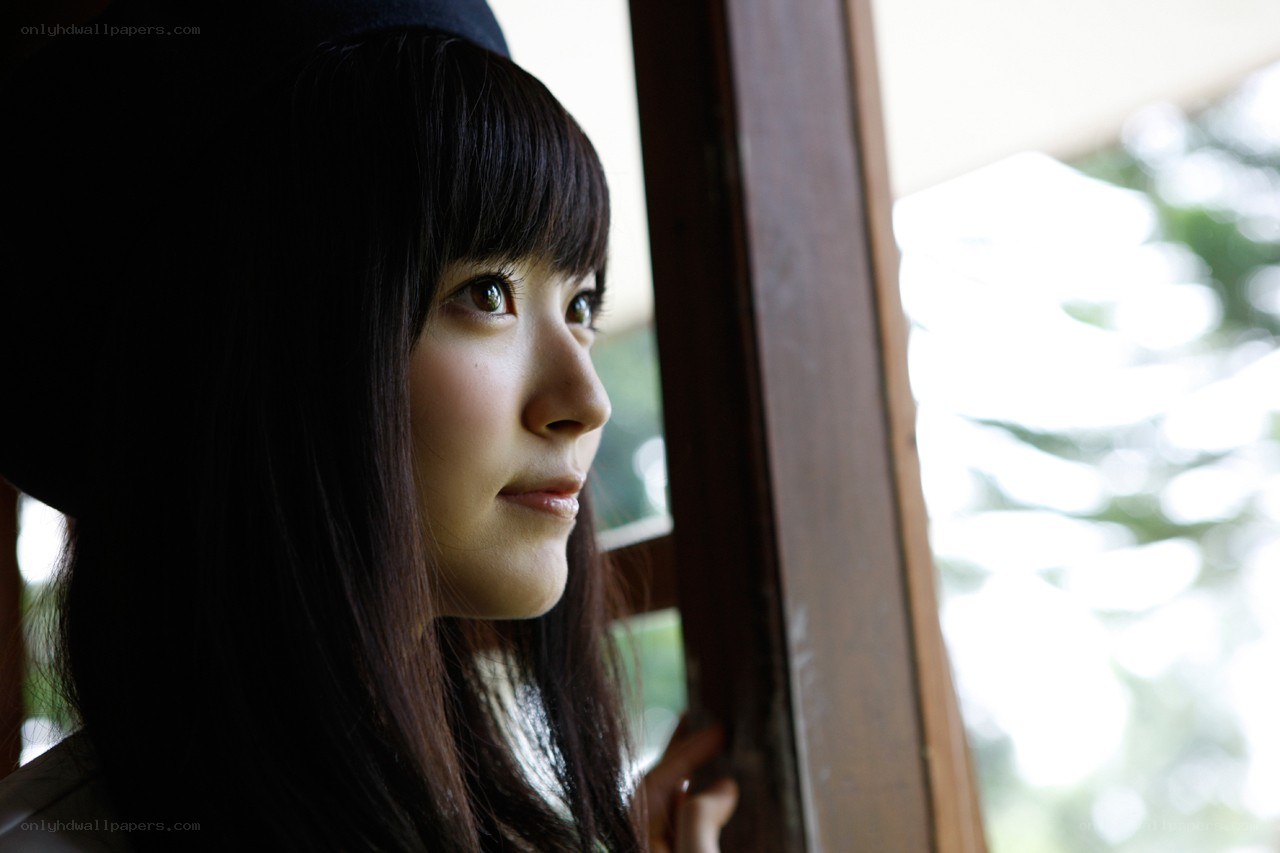 woman looking out window