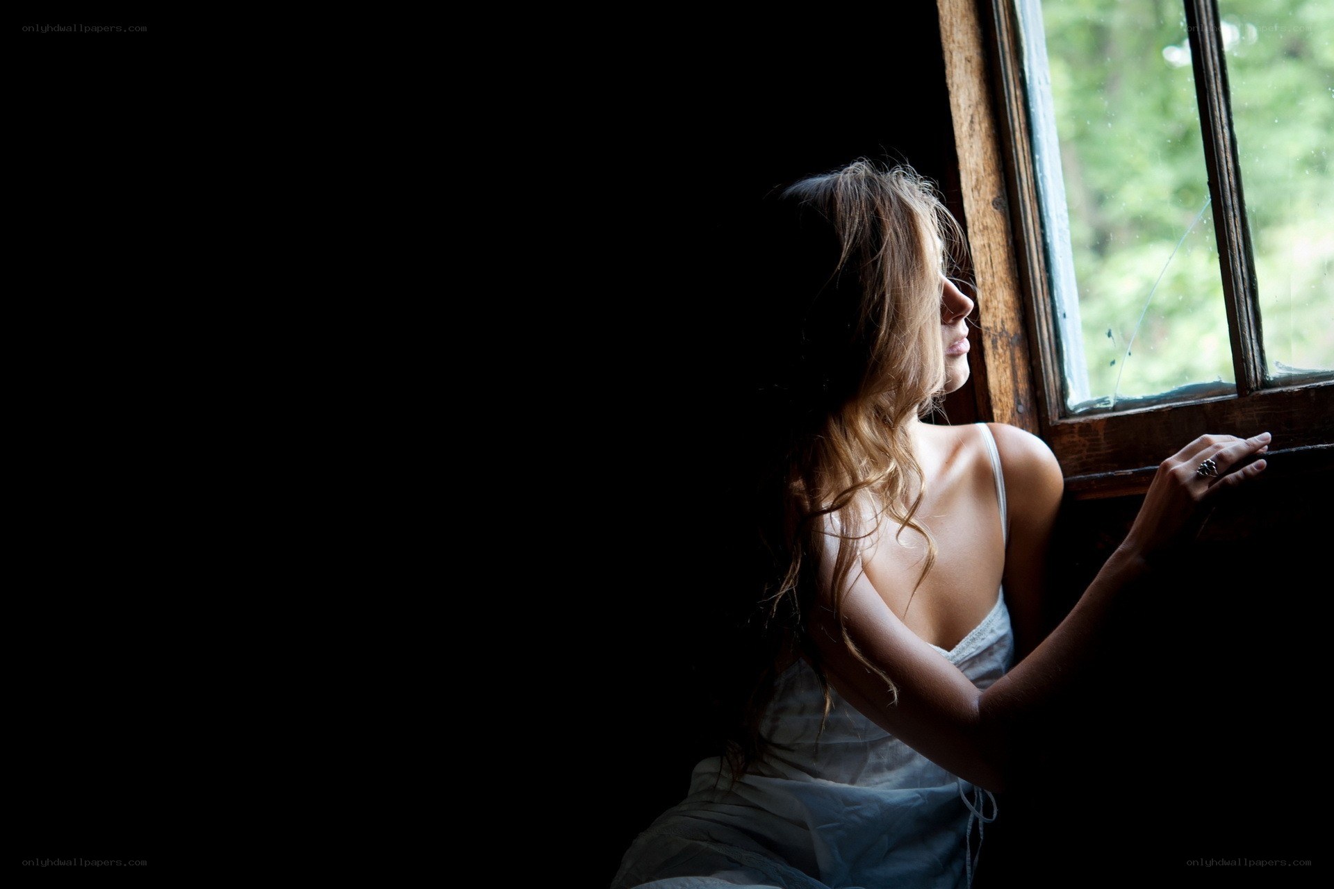 woman looking out window