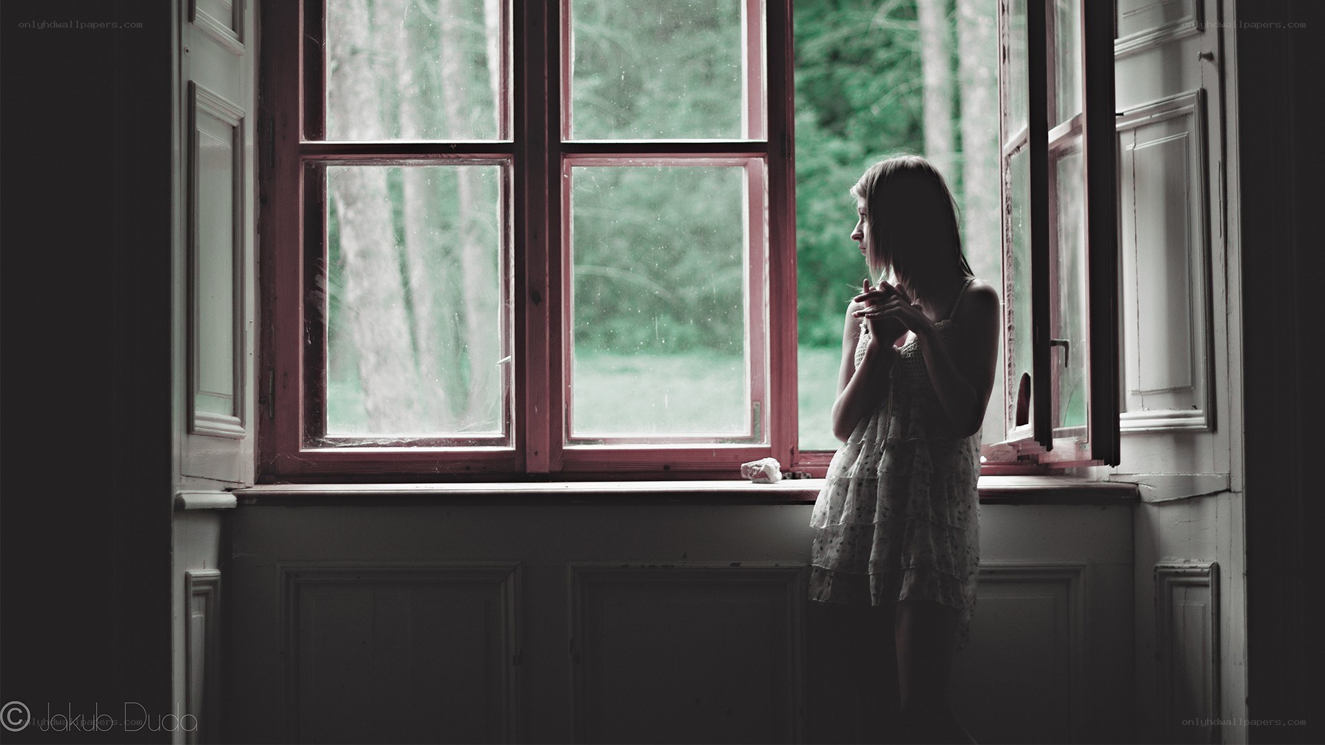 woman looking out window