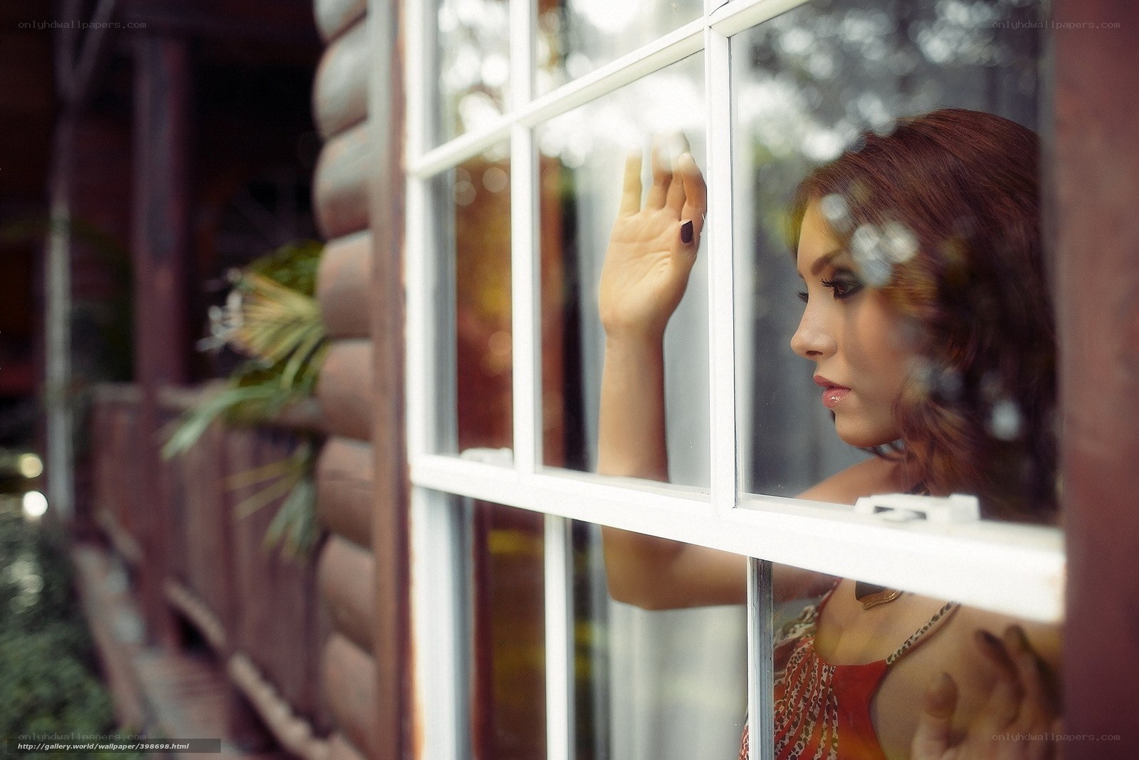 woman looking out window