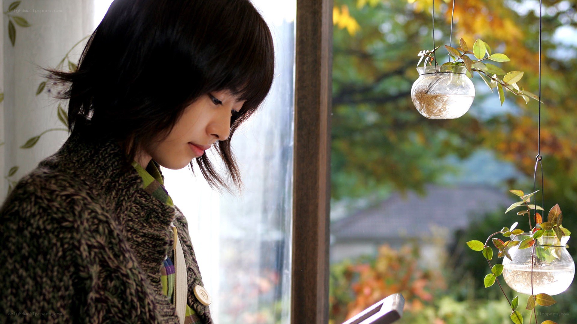woman looking out window