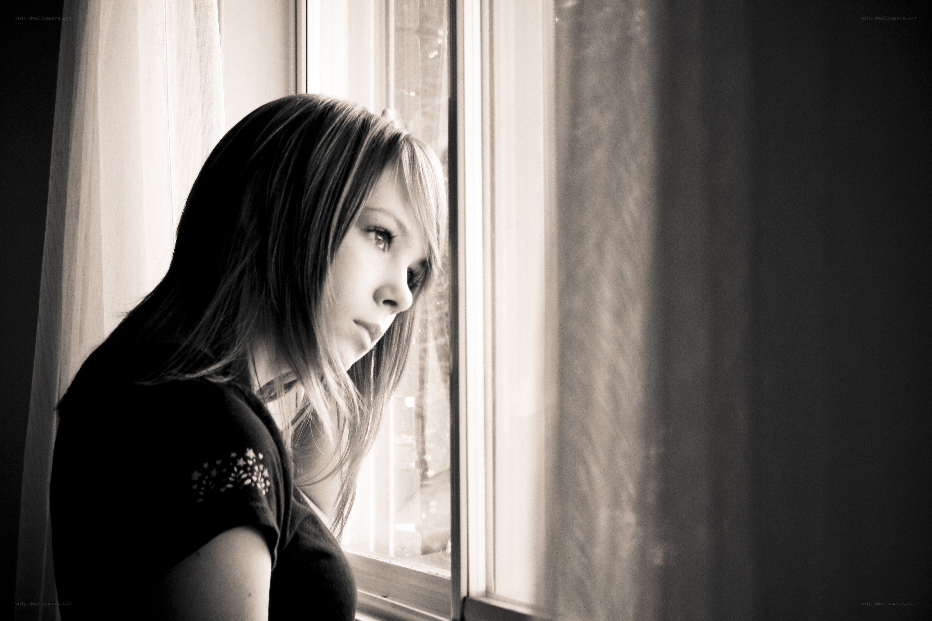 woman looking out window