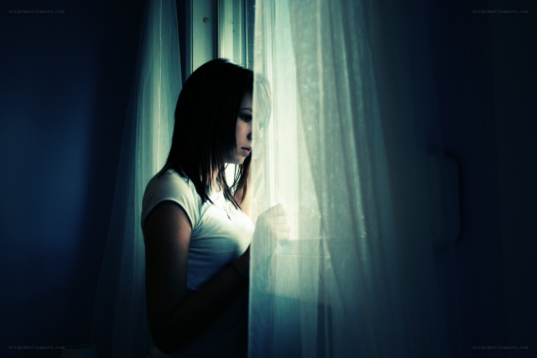 woman looking out window