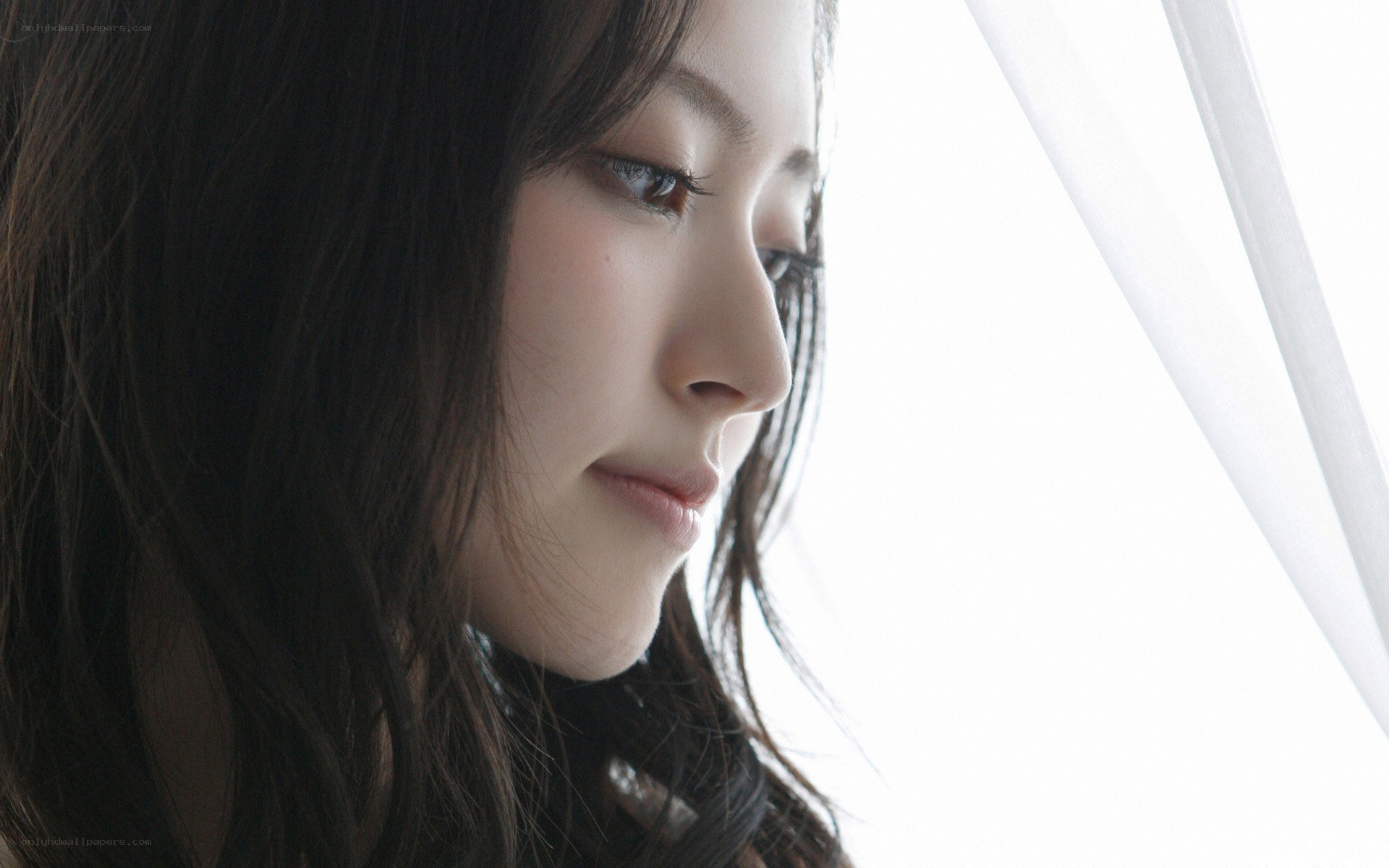 woman looking out window