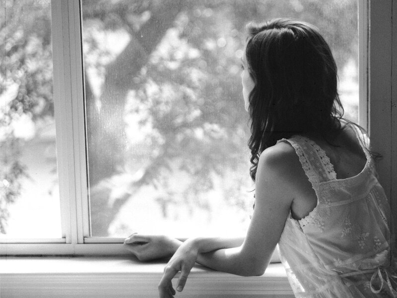 Woman Looking Out Window — Black, Contemplative