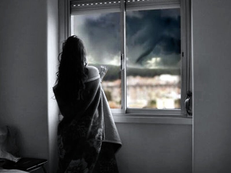 Woman Looking Out Window — Black, Dramatic