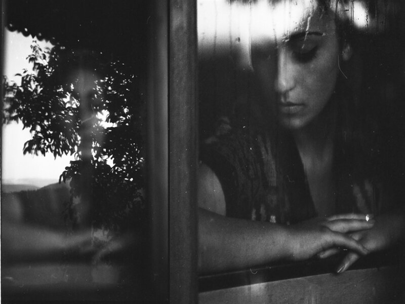 Woman Looking Out Window — Black, Melancholic