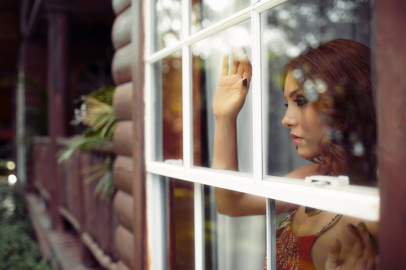 Woman Looking Out Window — Brown, Contemplative, Afternoon