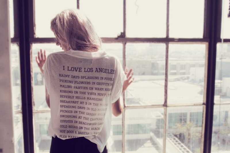 woman looking out window in LA
