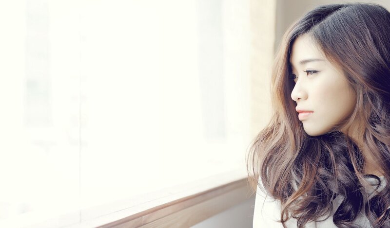 Woman Looking Out Window — White, Contemplative, Morning