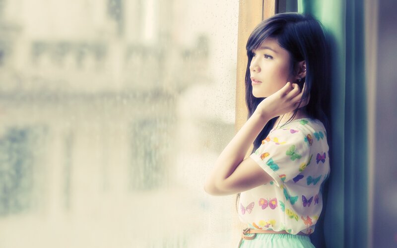 Woman Looking Out Window — White, Contemplative, Photograph, Raindrops