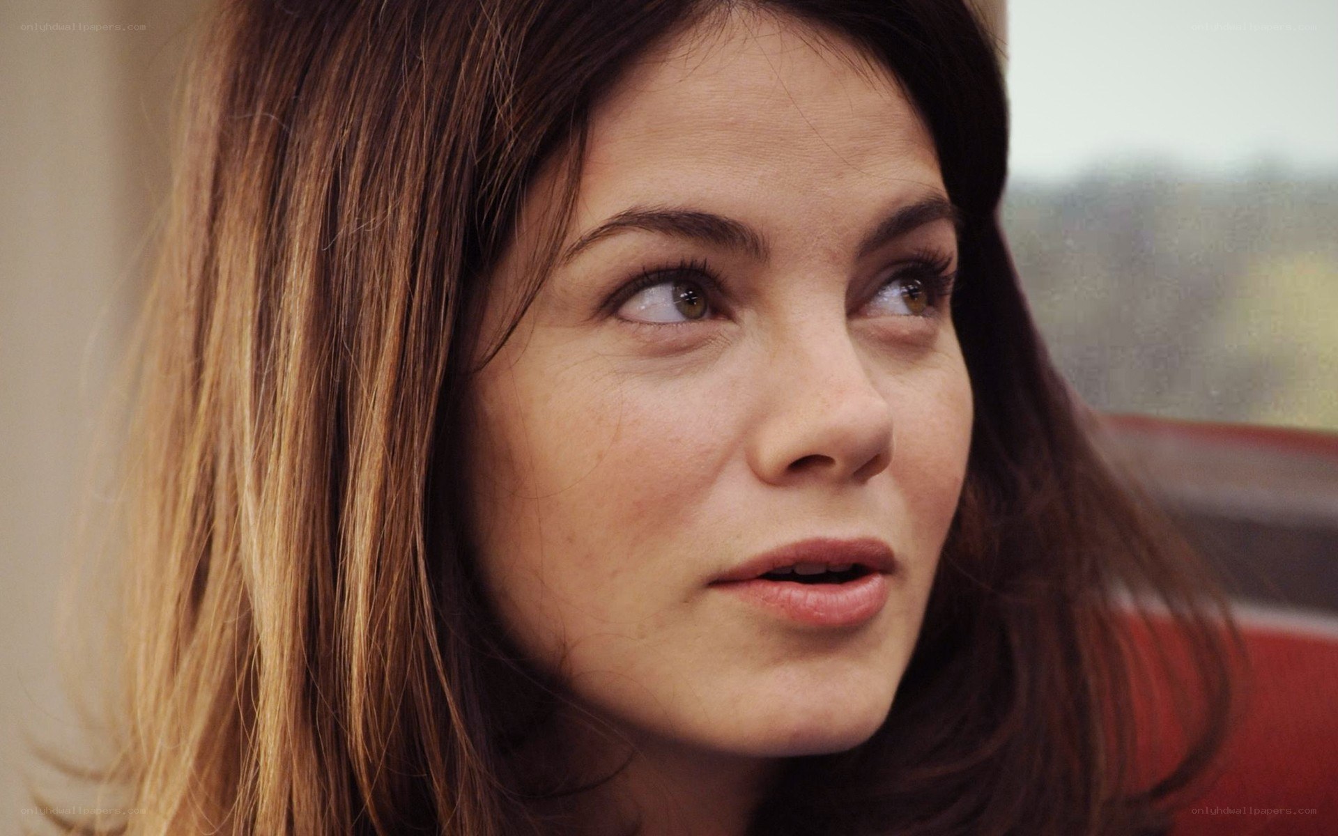 woman looking thoughtfully to side