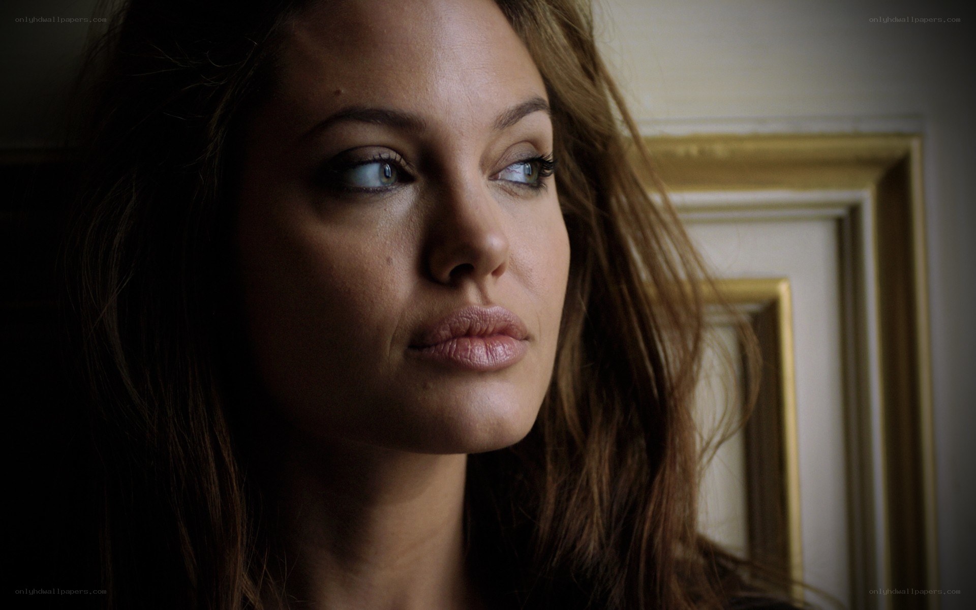woman looking thoughtfully to side
