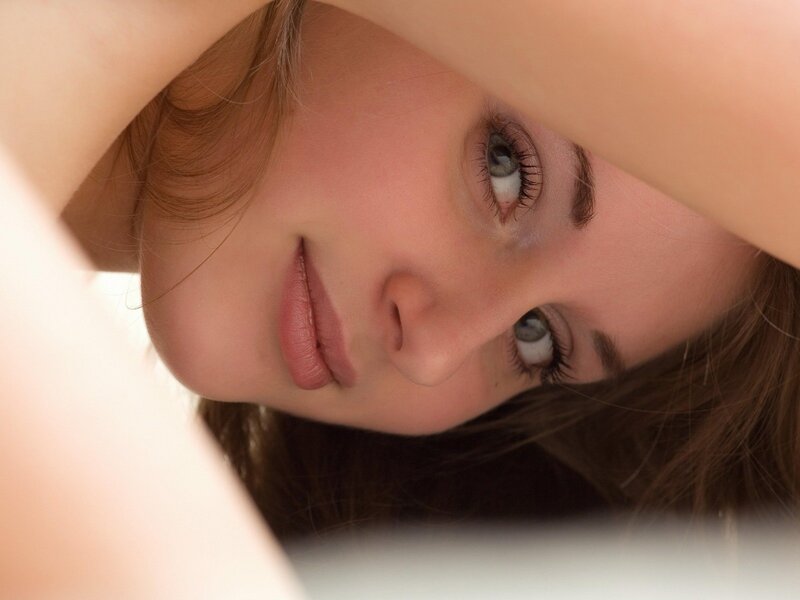 woman looking through arms
