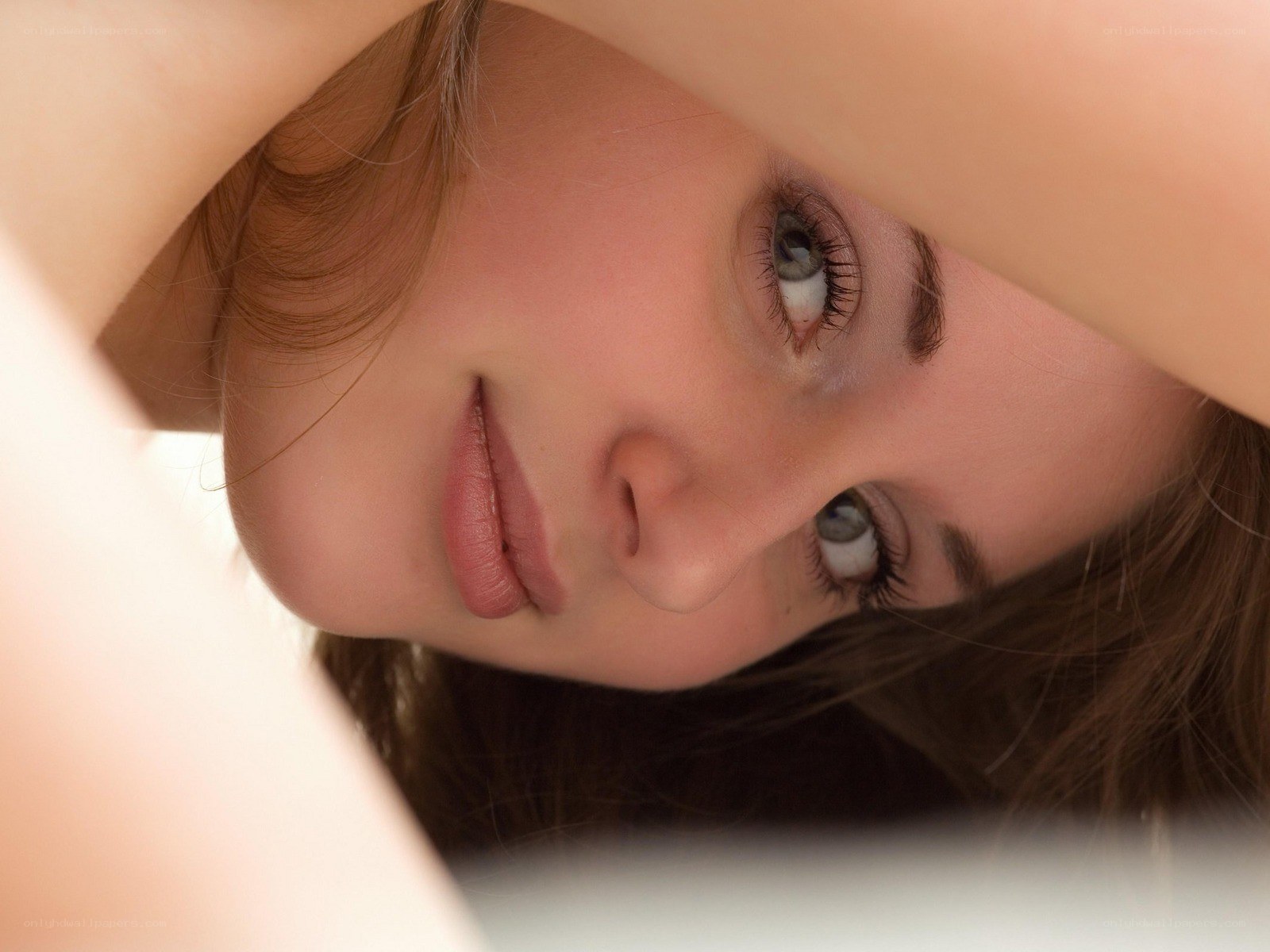 woman looking through arms