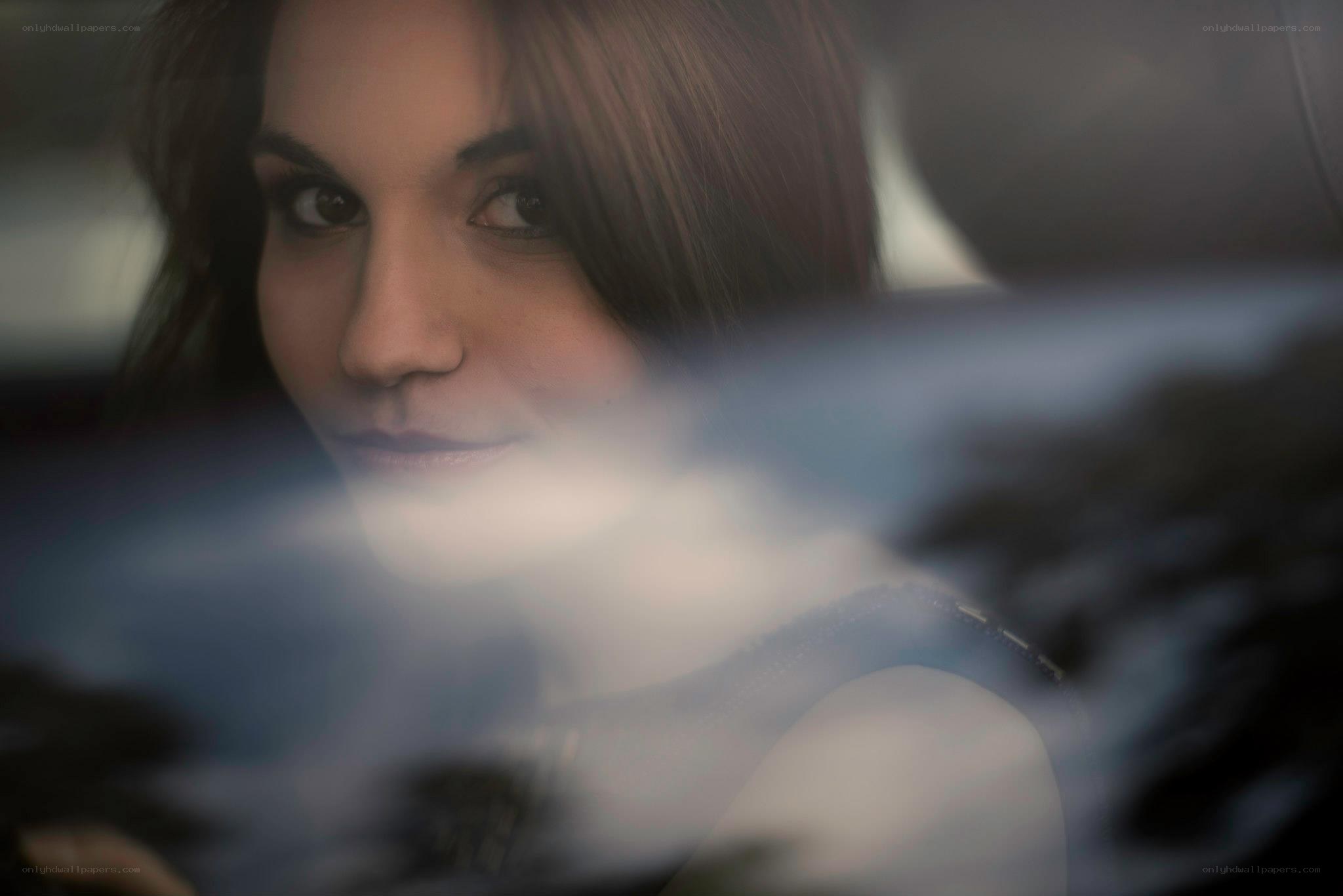 woman looking through car window