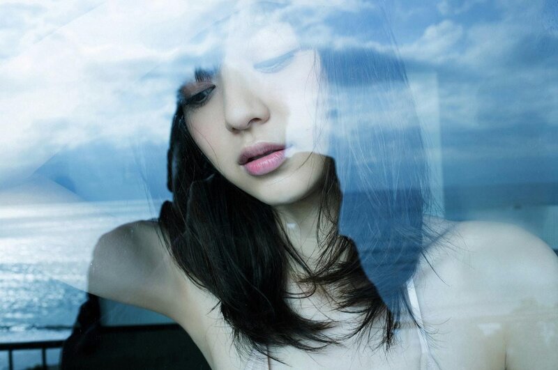 Woman Looking Through Glass — Blue