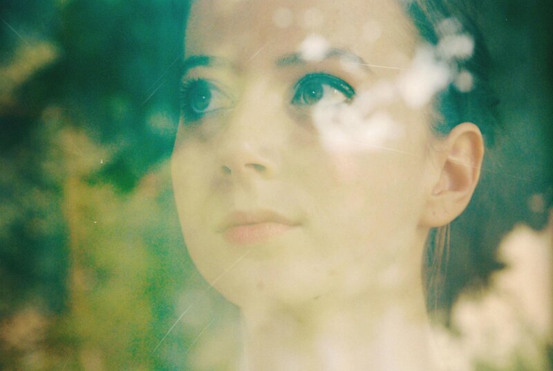 Woman Looking Through Glass — Green, Dreamy