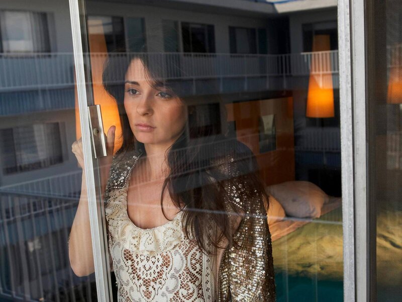 Woman Looking Through Glass — White, Contemplative