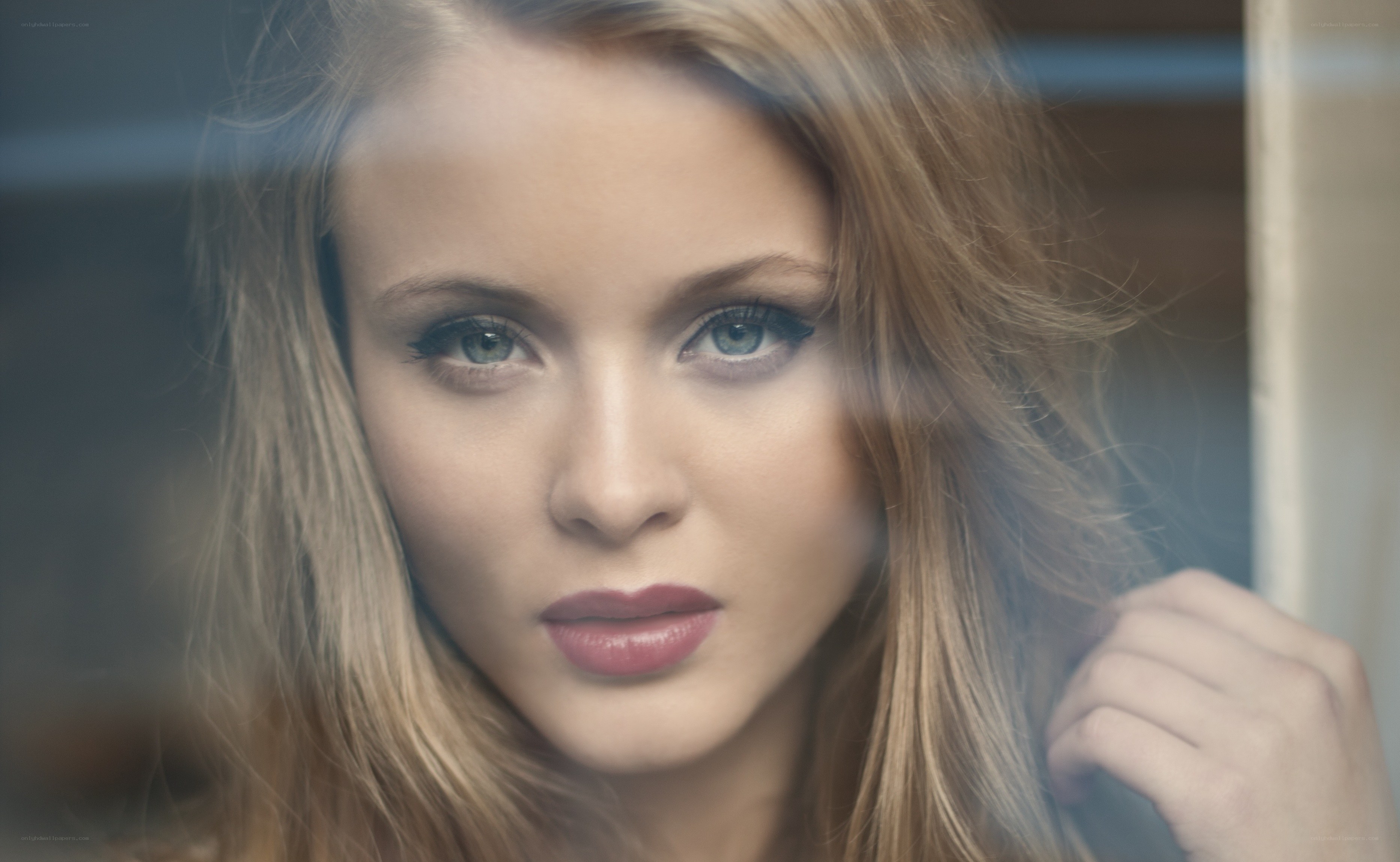 woman looking through glass
