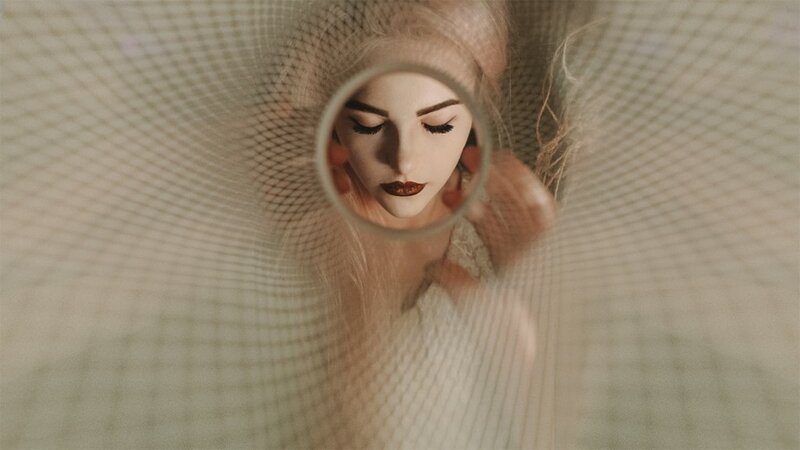 Woman Looking Through Mesh