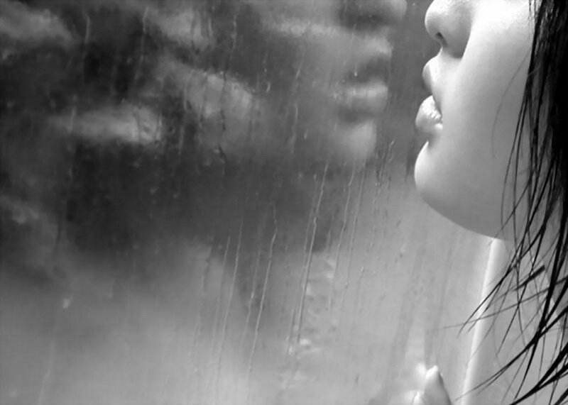 Woman Looking Through Rain-streaked Window — Black