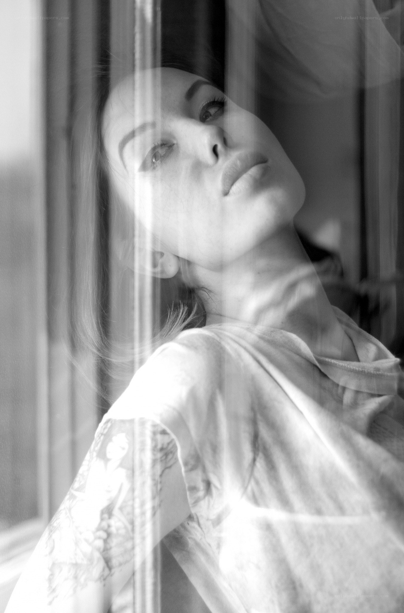 woman looking through window