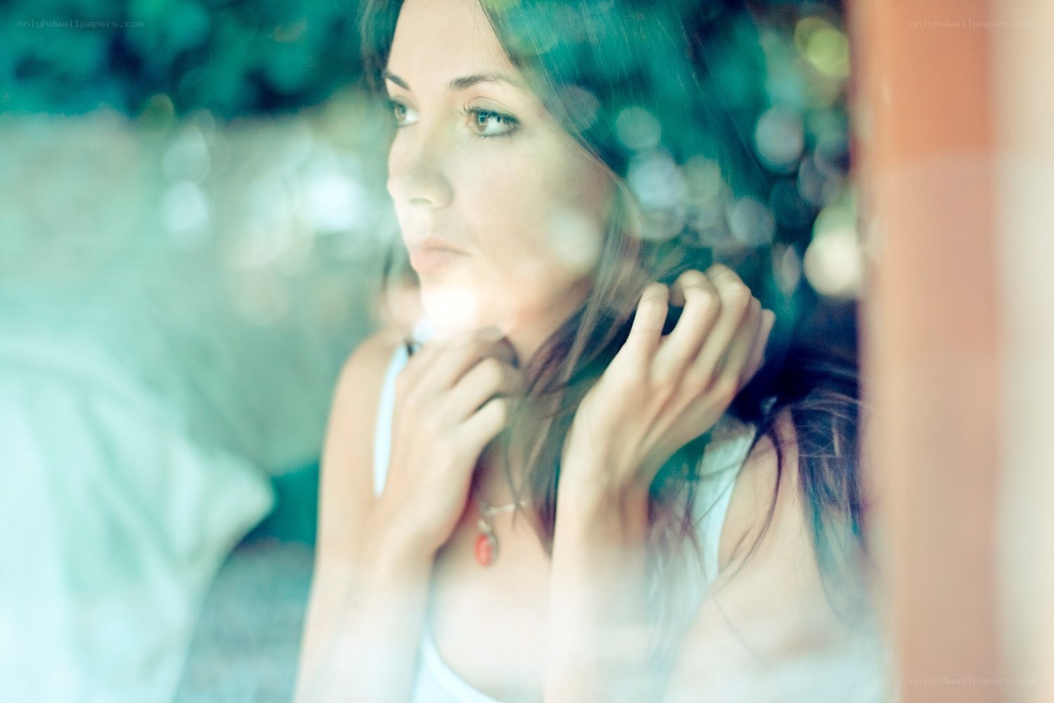 woman looking through window
