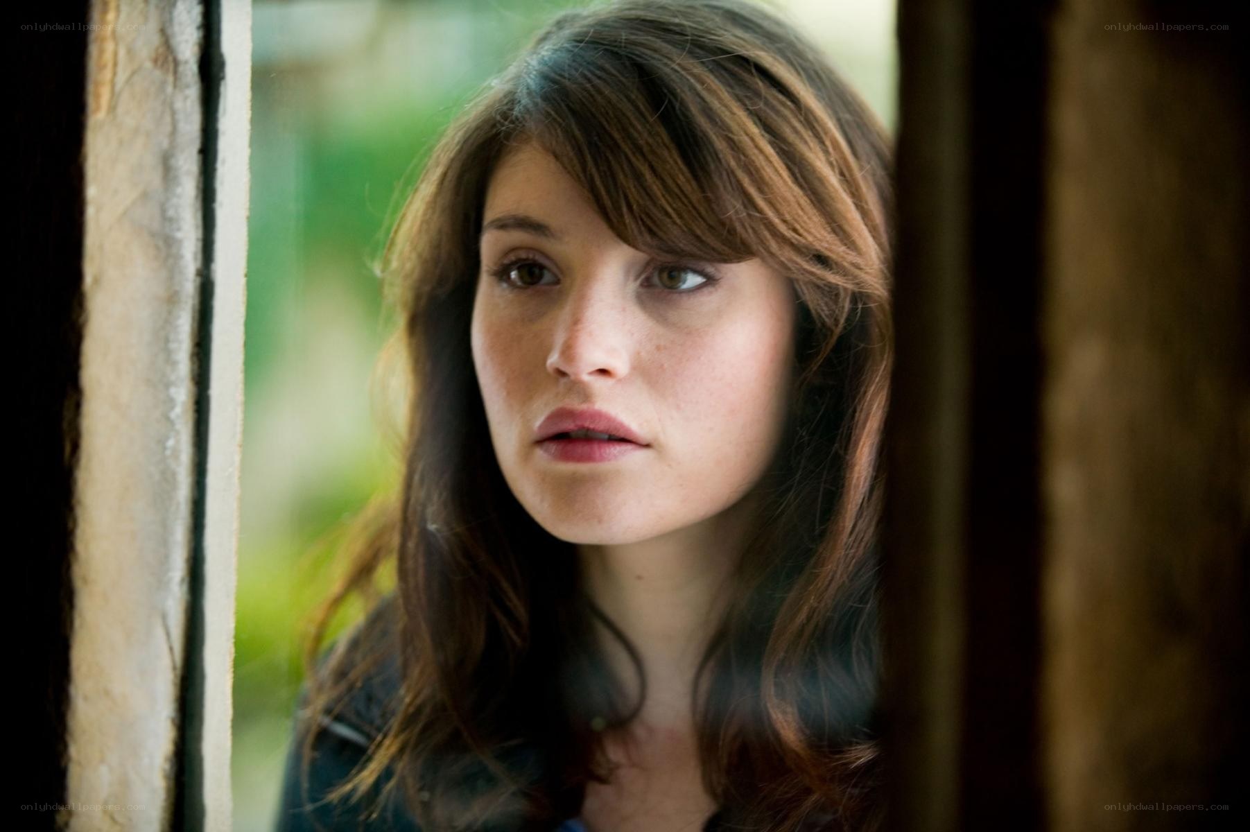 woman looking through window