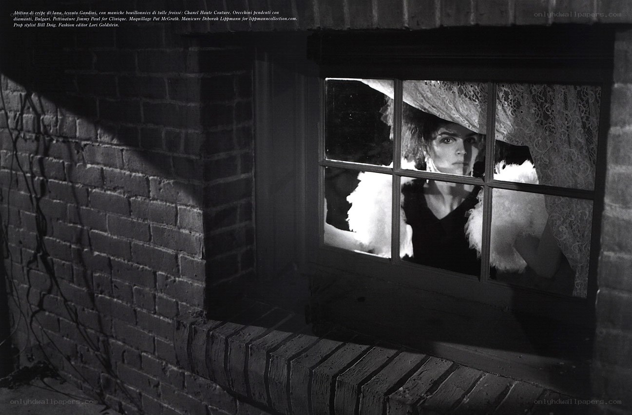 woman looking through window