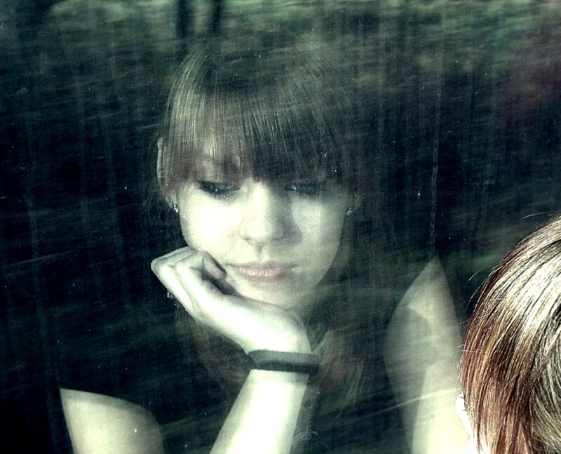 woman looking through window