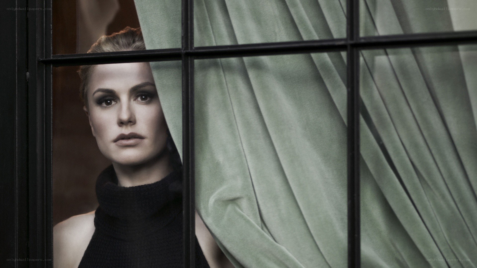 woman looking through window