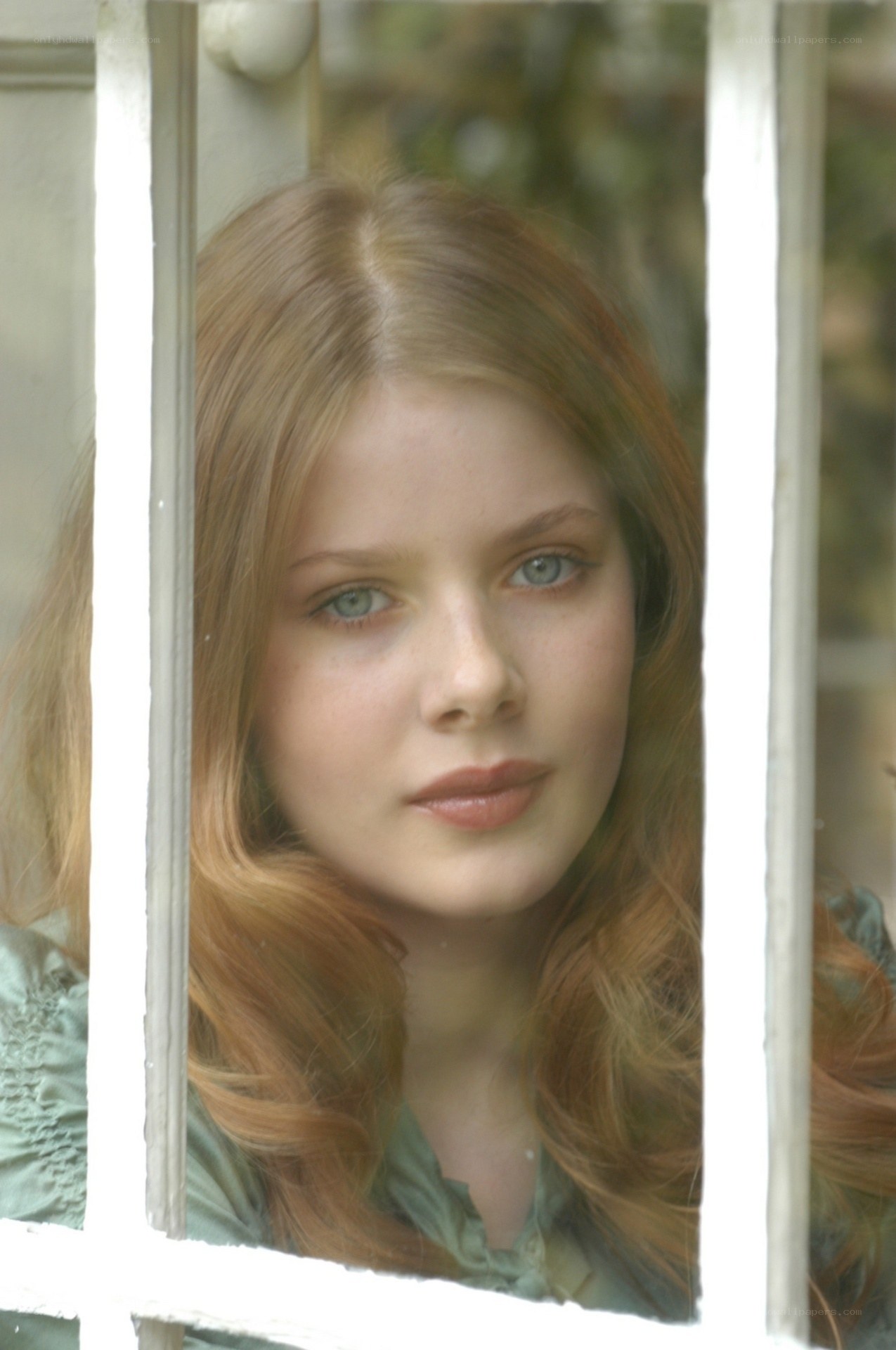 woman looking through window