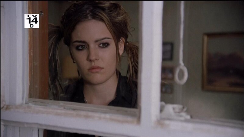 woman looking through window