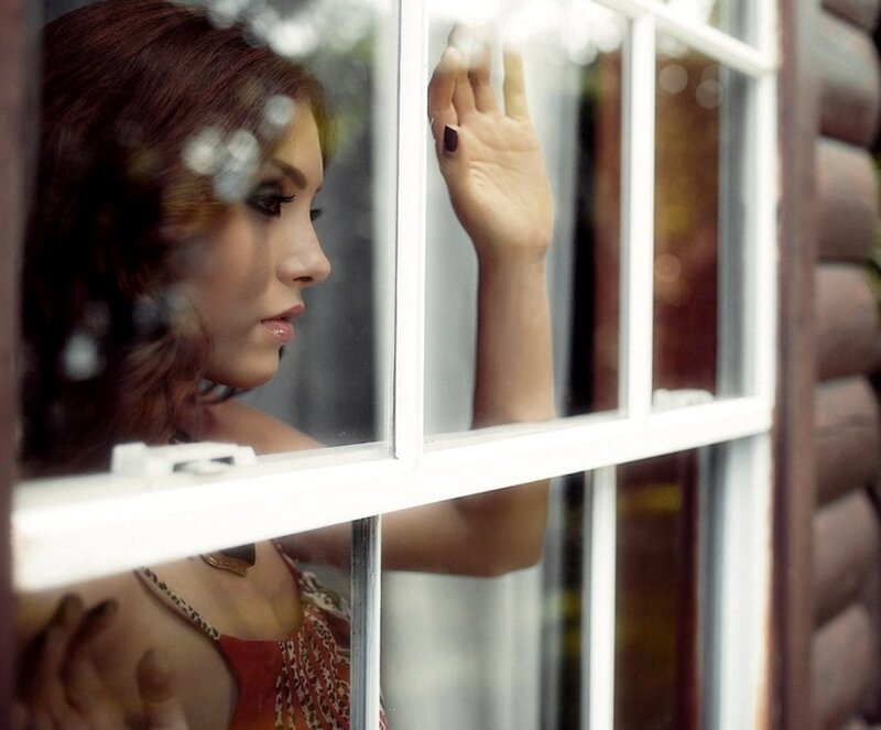 Woman Looking Through Window — Brown, Contemplative
