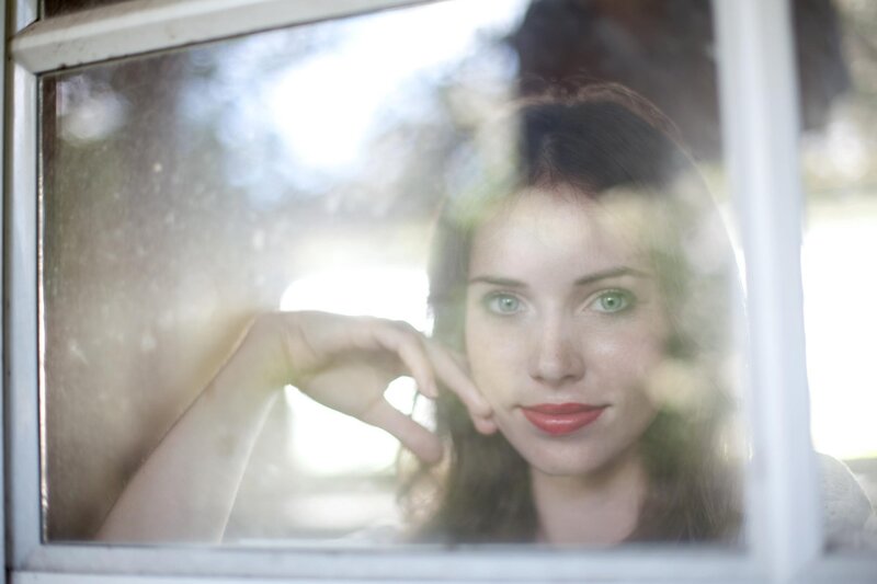 Woman Looking Through Window — Green, Contemplative