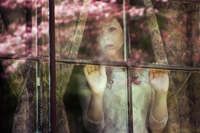 Woman Looking Through Window — Pink, Melancholic, Spring