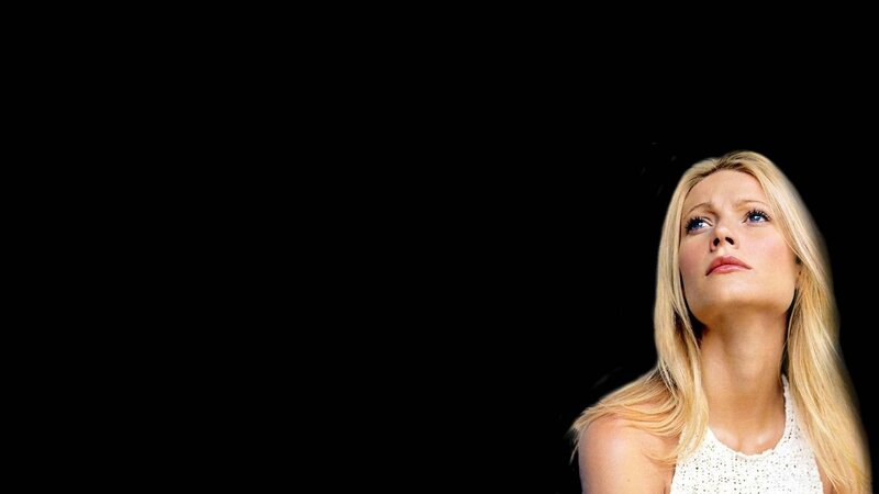 woman looking up against black background