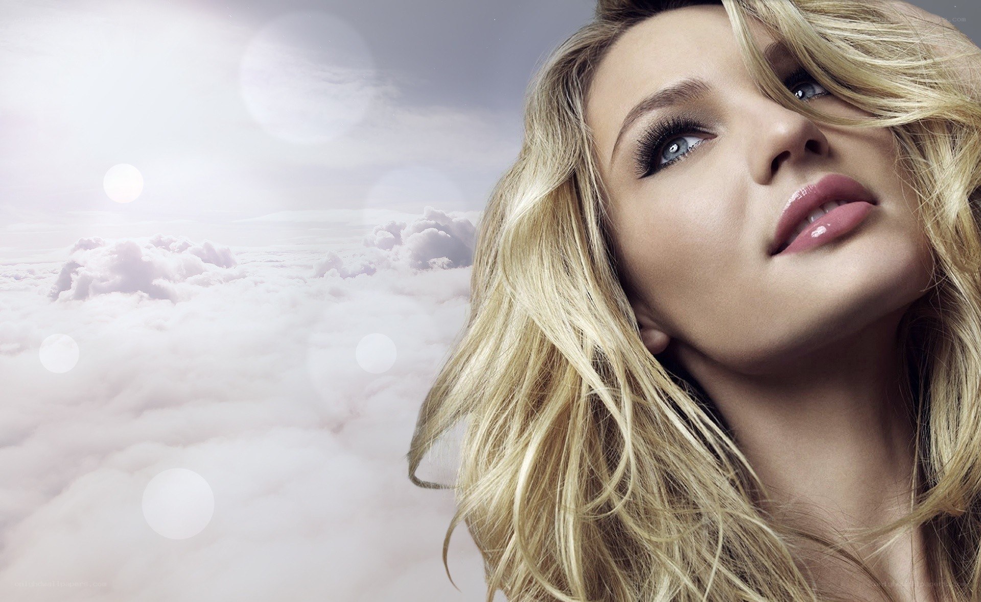 woman looking up at clouds